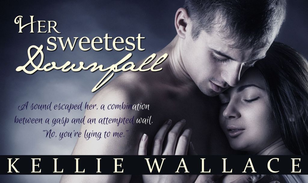 Young beautiful couple in each other's arms on a dark background