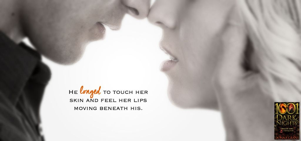 A man and woman with their heads together touching,